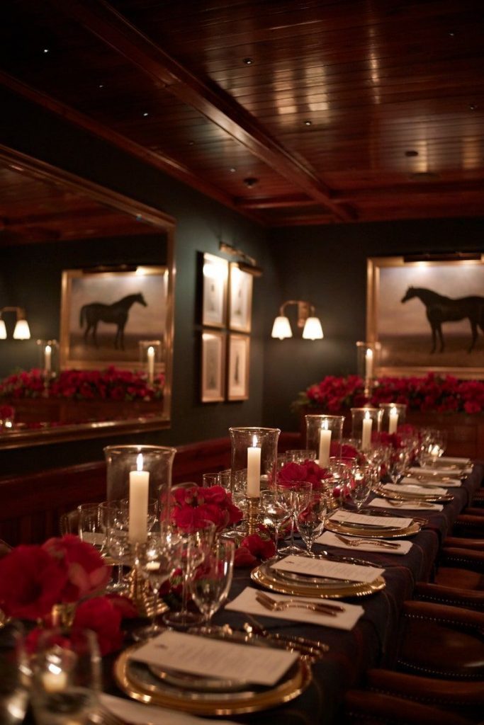 Luxury dining table in candlelight, Ralph Lauren Christmas style with tartan tablecloth and red roses